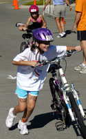 Photo of 2 bikers at transition area at the IronKids event.