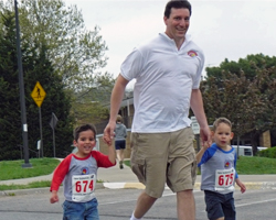Photo of Curtis Marsh and the boys at the Hilltop Hustle.