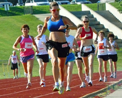 Photo of the womens 1500m at the Heartland Masters Track Meet.