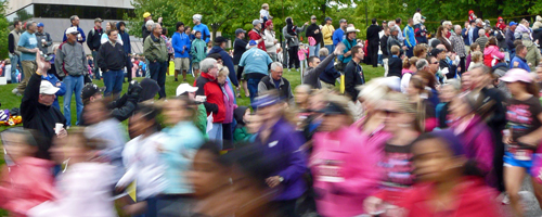 Photo of spouses watching the Moms race.