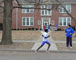 Photo of Benson Chesang in front of Woodlawn School on Thanksgiving Day.