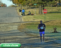 Photo of Benson Chesang with a huge lead at the November 6th Turkey Trot at Haskell and link to slideshow.