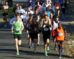 Photo of the leaders on 4th St at the runLawrence Thanksgiving Day 5K.