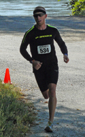 Photo of Tim Testa about half mile from finish of the Sandrat Trail Race.