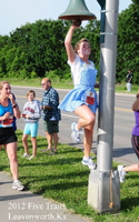 Photo of Brittney Visser rigning the bell at the Five Trails Half Marathon, at Leavenworth Kansas, Sunday, May 20, 2012.