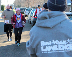 Photo of two graduates of the RunWalkLawrence Galloway Program at their "final exam"  run.
