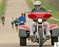 Red Dog Gardner on his motortrike leading the Run to Remember 5K on May 5, 2013 and link to the FLickr slideshow.