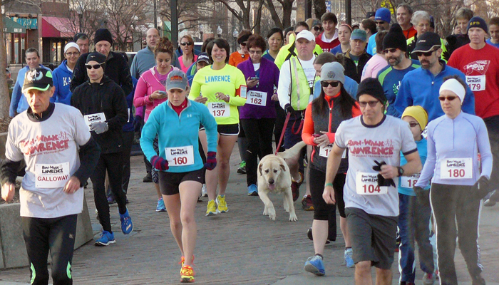 Photo of the 5K group run en masse on Mass. Jeff Galloway is on the left; J. Jenkins on the right.