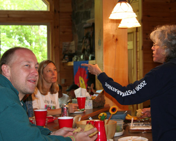 Molly making a point at the table